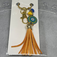 Load image into Gallery viewer, Keychain with tassel and decorative beads on a white card
