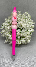 Load image into Gallery viewer, Pink pen with decorative beads on a gray background