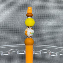 Load image into Gallery viewer, Decorative hair stick with colorful beads on a clear stand against a textured gray background
