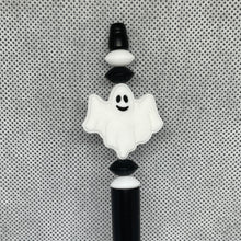 Load image into Gallery viewer, Decorative pen top with ghost design on a textured gray background
