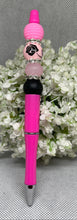 Load image into Gallery viewer, Pink pen with decorative top on a gray background
