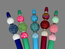 Load image into Gallery viewer, Colorful beaded pen toppers on a textured gray background
