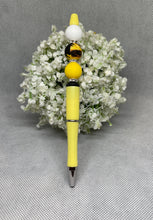 Load image into Gallery viewer, Yellow pen with decorative elements on a gray background
