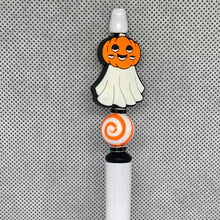Load image into Gallery viewer, Decorative pen top with ghost and pumpkin design on a textured gray background
