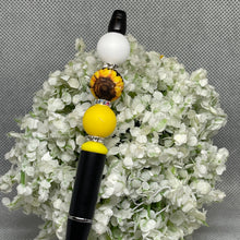 Load image into Gallery viewer, Pen with decorative beads on a bed of small white flowers
