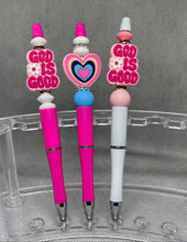 Load image into Gallery viewer, Three decorative pens with &#39;God is Good&#39; text on a clear stand.
