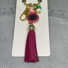 Load image into Gallery viewer, Keychain with tassel and colorful beads on a white card
