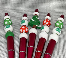 Load image into Gallery viewer, Set of Christmas-themed pens with decorative beads on a textured gray background
