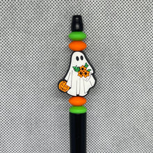Load image into Gallery viewer, Decorative pen top with ghost design, pumpkins, and flowers on a textured gray background
