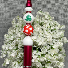 Load image into Gallery viewer, Decorative pen with red and white design on a floral background
