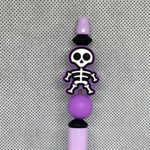 Load image into Gallery viewer, Purple skeleton-themed beadable pen on a textured gray background
