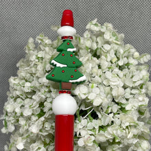 Load image into Gallery viewer, Decorative pen with Christmas tree design on a floral background
