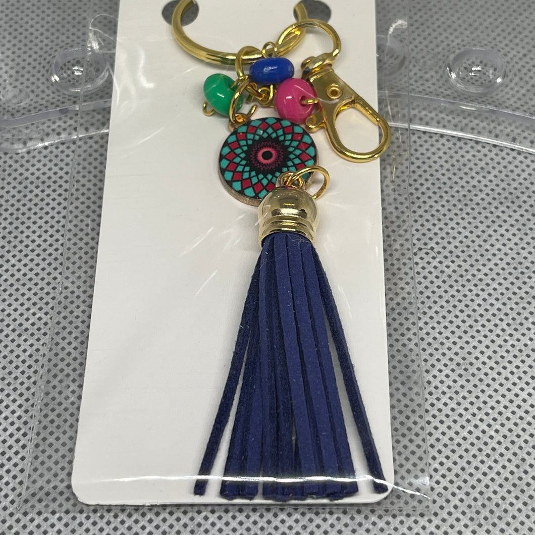 Keychain with tassel and colorful beads on a white card