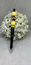 Load image into Gallery viewer, Pen with yellow accents on a white floral background
