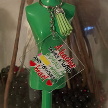 Load image into Gallery viewer, A Teacher Opens a Mind Takes &amp; Touches a Heart Acrylic Keychain Sticker 1.96"
