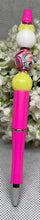 Load image into Gallery viewer, Pink pen with colorful beads on a gray background
