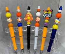Load image into Gallery viewer, Colorful pens with decorative beads on a gray background
