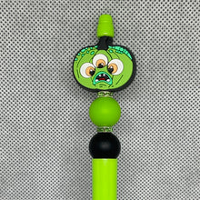 Load image into Gallery viewer, Green character charm on a green Beadable Pen against a gray textured background
