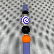 Load image into Gallery viewer, Beaded pen with purple, black, and orange beads on a textured gray background
