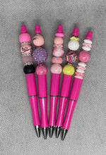 Load image into Gallery viewer, Set of pink pens with decorative beads on a textured surface
