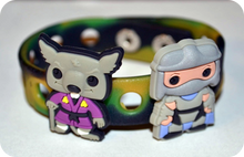 Load image into Gallery viewer, Two small figurines, one resembling a wolf in a kimono and the other resembling a character in a gray outfit, on a colorful background.
