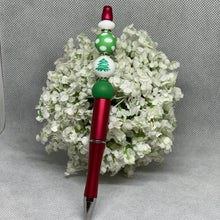 Load image into Gallery viewer, Pen with decorative beads on a white floral background
