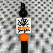 Load image into Gallery viewer, Halloween-themed beadable pen with &#39;Spooky Season&#39; text on a textured gray background
