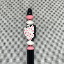 Load image into Gallery viewer, Decorative pen tip with angel wings and pink hearts on a textured gray background
