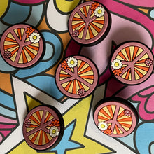 Load image into Gallery viewer, Colorful abstract design with circular patterns and a star shape.
