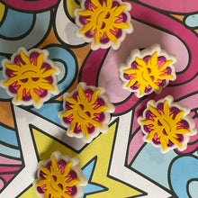 Load image into Gallery viewer, Colorful star-shaped objects on a vibrant, abstract background

