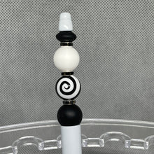 Load image into Gallery viewer, Decorative object with black, white, and gray spiral design on a textured gray background
