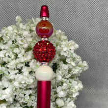 Load image into Gallery viewer, Decorative beadable pen with red and white beads on a floral background
