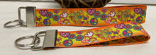Load image into Gallery viewer, Groovy Retro Orange Peace Symbol GrosGrain Ribbon Wristlets Keychains Set
